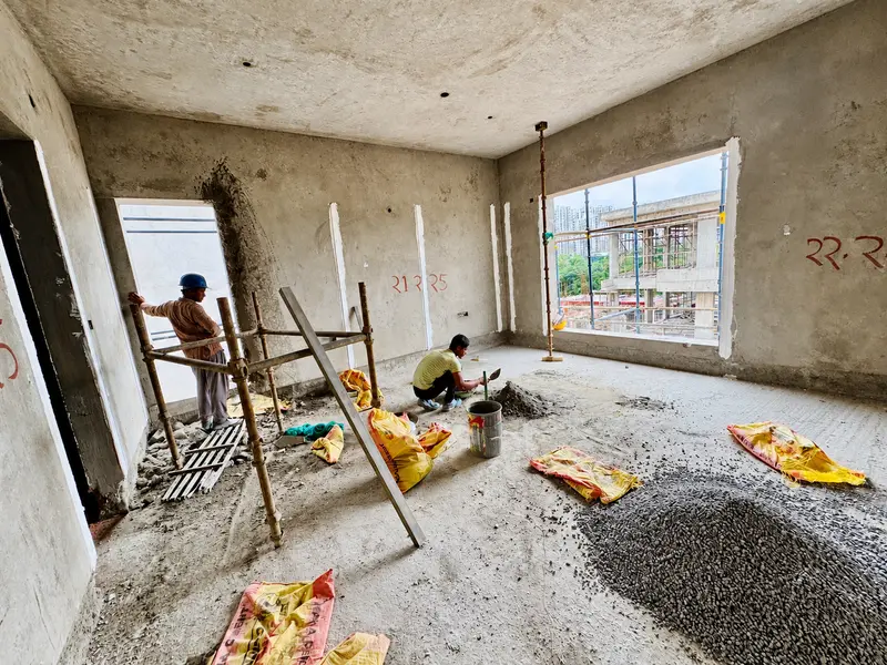 Internal wall preparation and floor work in progress.