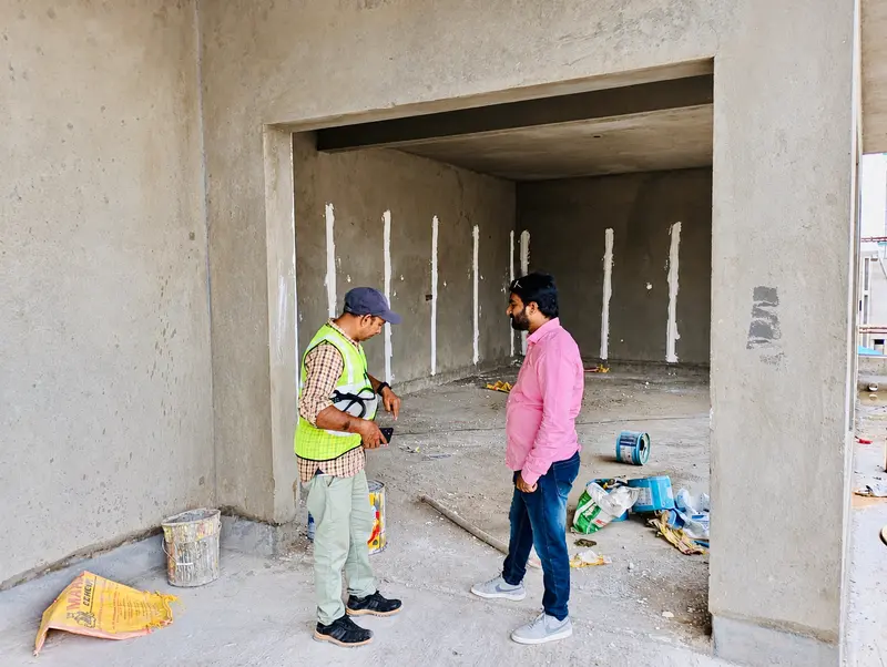 Site discussion at an unfinished internal space.