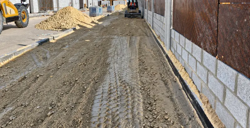 Ground preparation and compaction for external works.