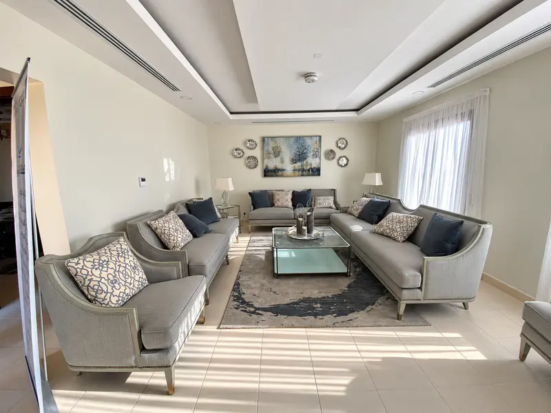 Coordinated seating, ceiling details and decorative wall finishes.