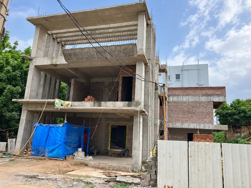 Concrete frame and masonry construction in progress.